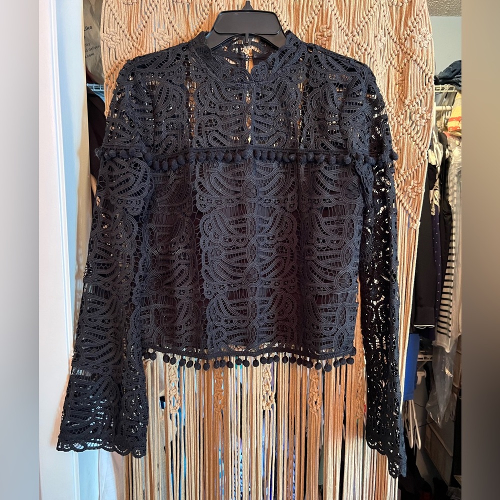 Beautiful crocheted like black top by Tularosa